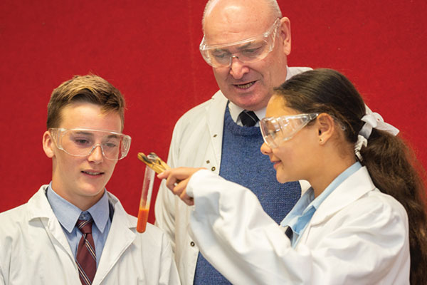 St Patrick's College Sutherland - students with teacher at a lab experiment