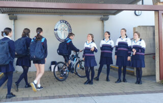St Patrick's College students are greeted at the school gate by their student leaders on Feel Good Friday